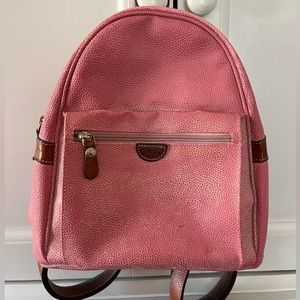 Pink leather backpack with brown accents by Bric’s.